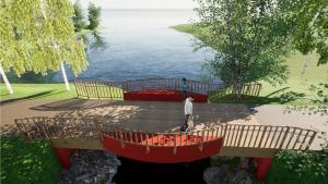 Kevyen liikenteen silta, jossa kummallakin reunalla on kaarevasti ulkonevat syvennykset punaisille penkeille.